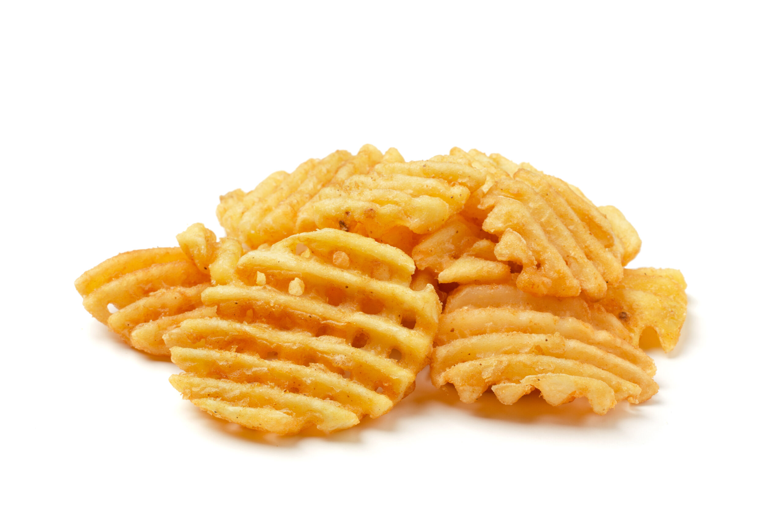 Waffle french fries stacked on each other.