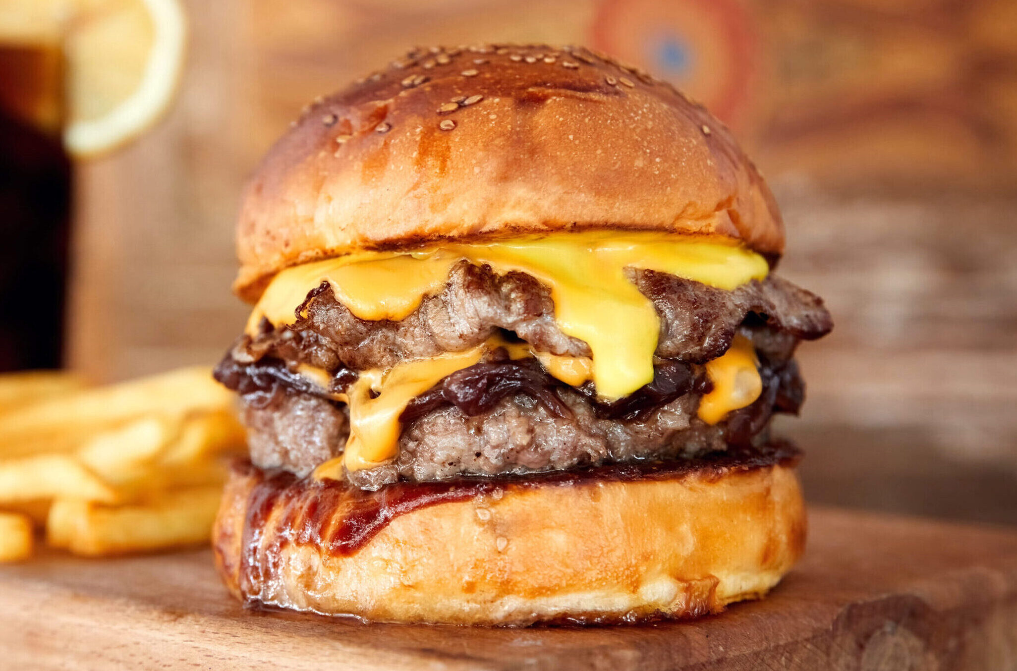 Bacon cheeseburger with fries.