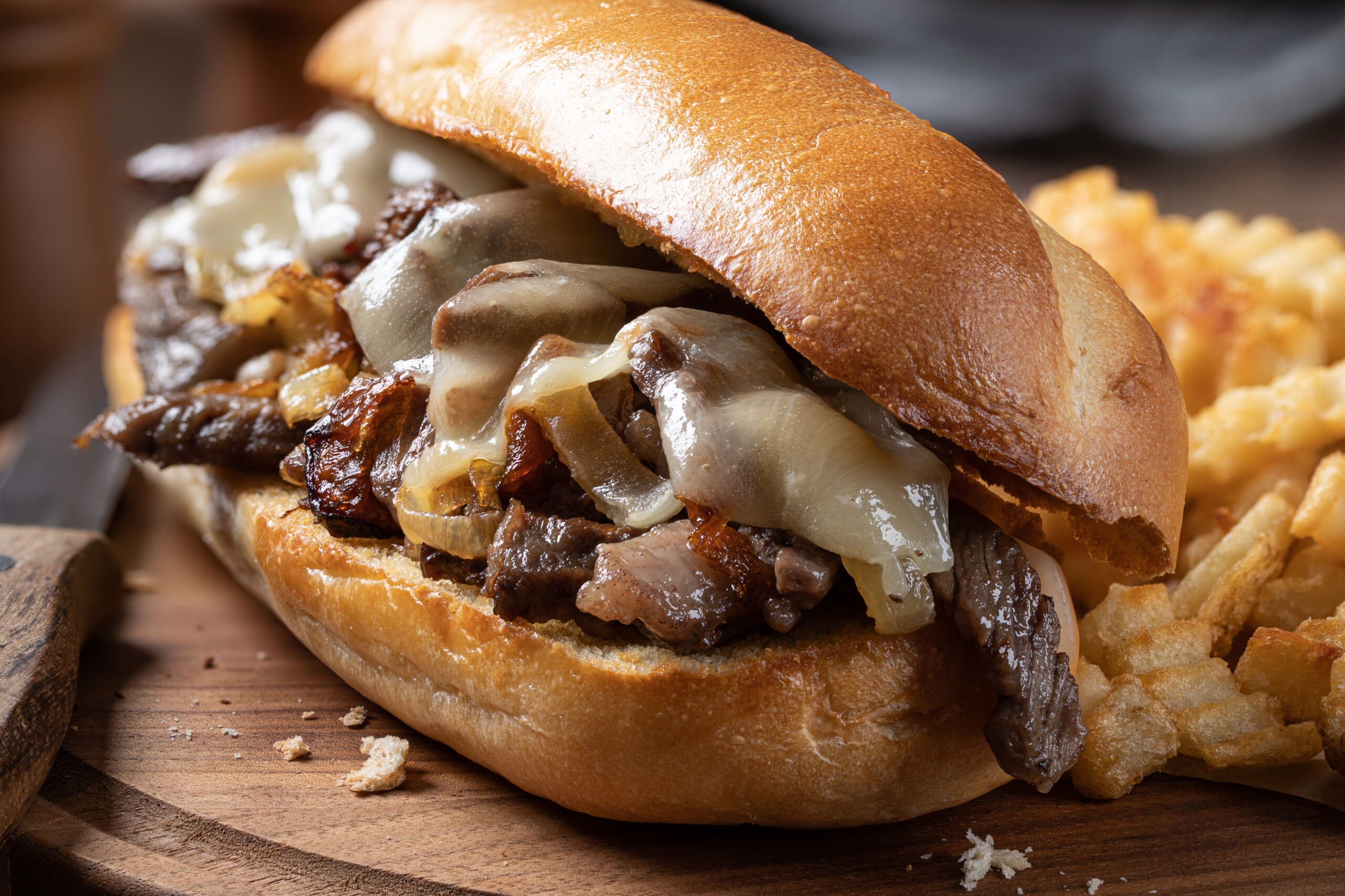 Cheesesteak with fries.