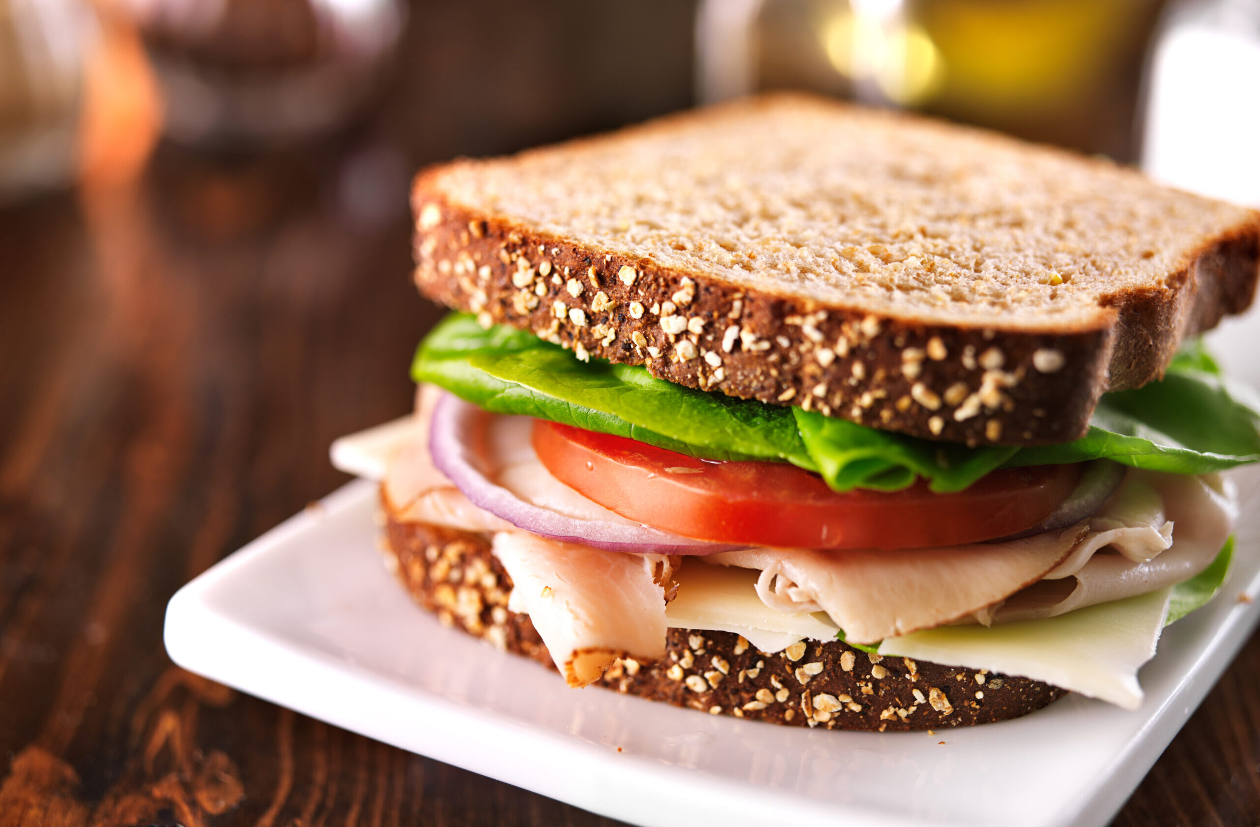 Bacon lettuce tomato sandwich on a plate.