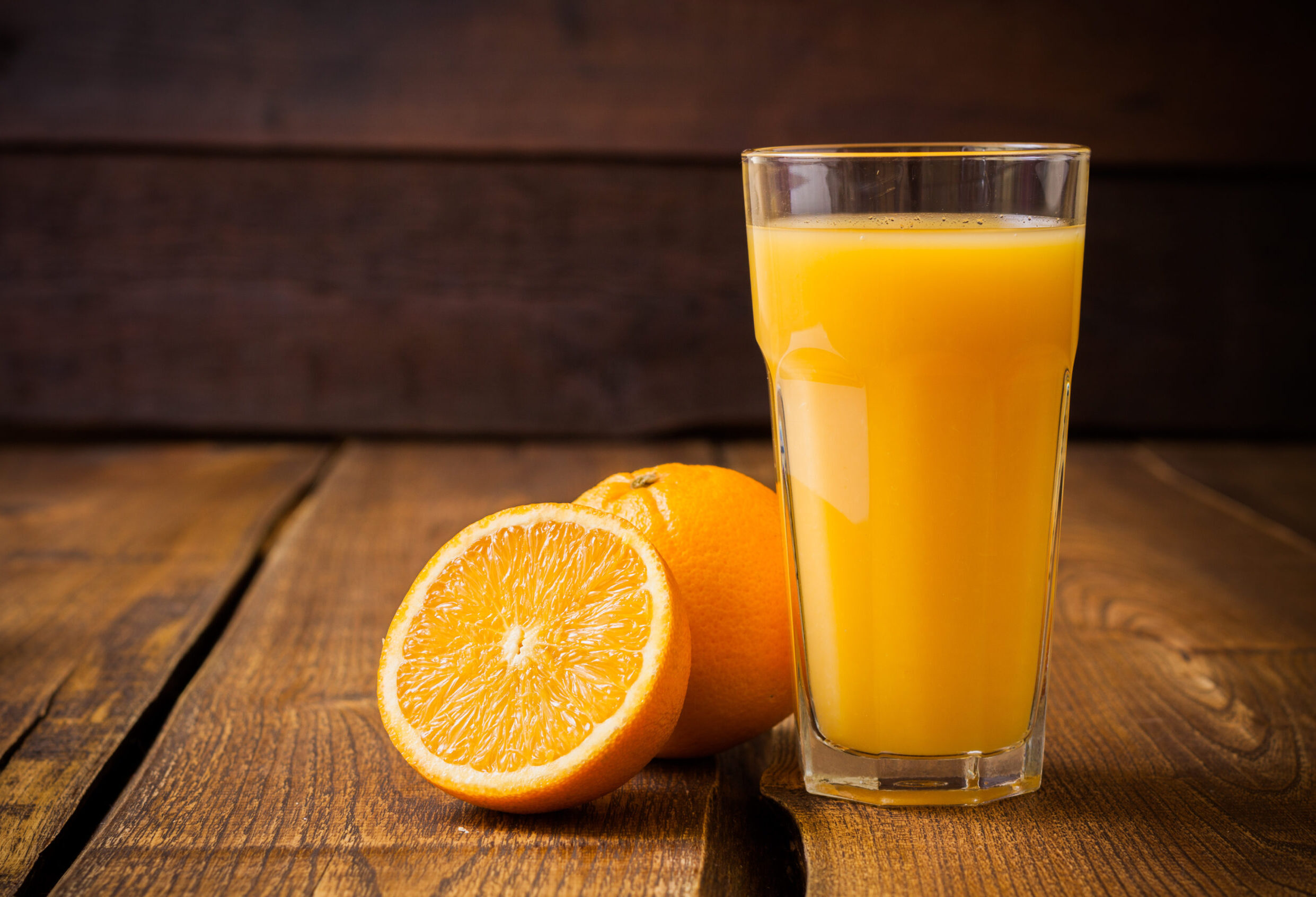Orange juice cup with orange sliced.
