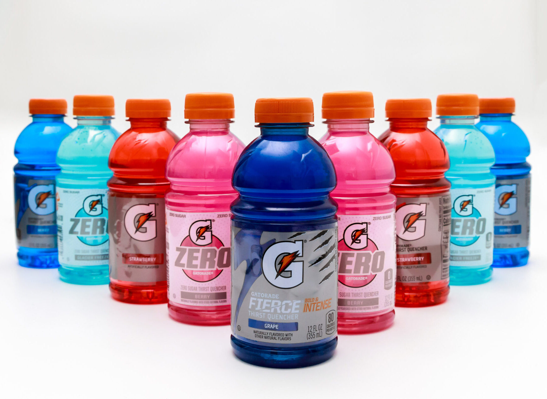 nine bottles of Gatorade organized in a bowling configuration.