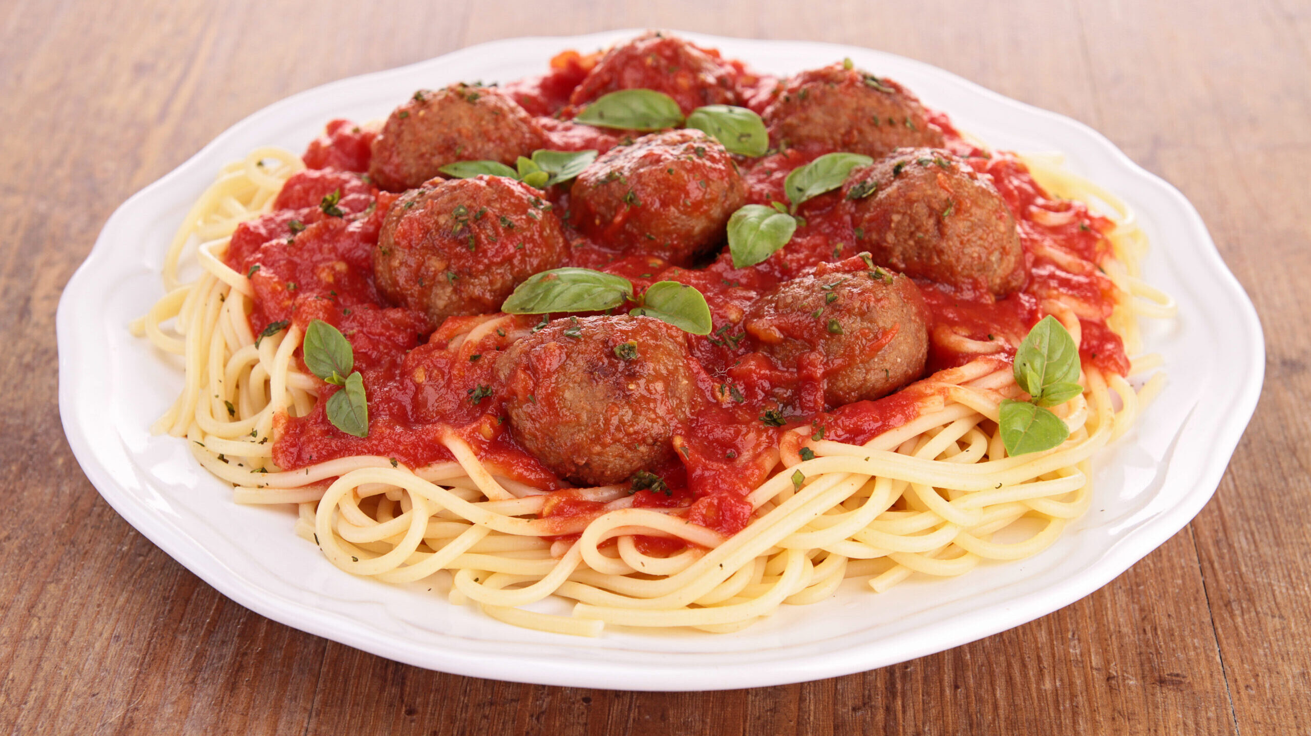 Spaghetti and meatballs on a plate.